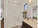 Modern bathroom with a large glass shower and white subway tiles at 696 Regatta Way, Bradenton, FL 34208