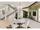 Bright breakfast nook features a round table and chairs, offering a view of the backyard at 696 Regatta Way, Bradenton, FL 34208