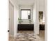Elegant hallway features built-in cabinetry and a stylish rug at 696 Regatta Way, Bradenton, FL 34208
