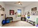 Home gym with tv, weights, and exercise equipment at 696 Regatta Way, Bradenton, FL 34208