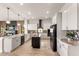 Spacious kitchen featuring a large island and modern cabinetry at 696 Regatta Way, Bradenton, FL 34208
