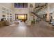 Bright living room with high ceilings, hardwood floors, and stunning sunset views at 696 Regatta Way, Bradenton, FL 34208