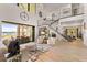 Open living area with water views, high ceilings, and modern furniture at 696 Regatta Way, Bradenton, FL 34208