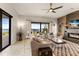 Living room with water views, fireplace, and comfortable seating at 696 Regatta Way, Bradenton, FL 34208