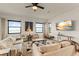 Bright living room featuring water views and comfy seating at 696 Regatta Way, Bradenton, FL 34208