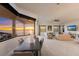 Living room with sunset views, comfortable seating, and a dining area at 696 Regatta Way, Bradenton, FL 34208