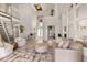 Spacious living room boasts high ceilings and ample natural light, creating an open and airy feel at 696 Regatta Way, Bradenton, FL 34208