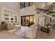 Open living room with high ceilings, hardwood floors and sunset view at 696 Regatta Way, Bradenton, FL 34208