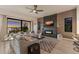 Living room with sunset views, fireplace, and ample seating at 696 Regatta Way, Bradenton, FL 34208