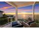 Relaxing waterfront patio boasts sunset views and comfortable seating at 696 Regatta Way, Bradenton, FL 34208