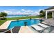 Relaxing pool area with water views and lounge chairs at 696 Regatta Way, Bradenton, FL 34208