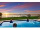 Inviting pool with sunset view and ample space for relaxation at 696 Regatta Way, Bradenton, FL 34208