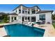 Resort-style pool with expansive patio and lounge chairs at 696 Regatta Way, Bradenton, FL 34208