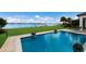 Stunning pool and patio with beautiful water views at 696 Regatta Way, Bradenton, FL 34208
