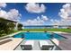 Enjoy this amazing pool with water views and lounge chairs at 696 Regatta Way, Bradenton, FL 34208