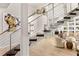 Modern staircase with metal railing and dark wood steps at 696 Regatta Way, Bradenton, FL 34208
