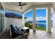 Covered patio with outdoor seating and stunning water views at 696 Regatta Way, Bradenton, FL 34208