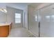 Elegant bathroom with a large walk-in shower and double vanity at 7228 Great Egret Blvd, Sarasota, FL 34241