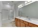 Bathroom with double vanity, mirror, and bathtub at 7228 Great Egret Blvd, Sarasota, FL 34241