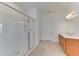 Bathroom with walk-in shower, double vanity, and modern light fixtures at 7228 Great Egret Blvd, Sarasota, FL 34241