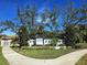 Community entrance sign for Heron Landing with landscaping and walkway at 7228 Great Egret Blvd, Sarasota, FL 34241