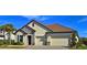 Two-story house with a two-car garage and stone accents at 7228 Great Egret Blvd, Sarasota, FL 34241