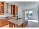 Kitchen with island, granite countertops, and stainless steel appliances at 7228 Great Egret Blvd, Sarasota, FL 34241
