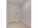 Empty storage or utility room with tile flooring and door at 7228 Great Egret Blvd, Sarasota, FL 34241
