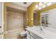 Clean bathroom with beige tile, bathtub, and single sink vanity at 7505 4Th W Ave # 7505, Bradenton, FL 34209