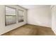 Simple bedroom with carpet, double windows and mirrored closet doors at 7505 4Th W Ave # 7505, Bradenton, FL 34209