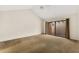 Spacious bedroom with carpet, sliding door to patio, and ceiling fan at 7505 4Th W Ave # 7505, Bradenton, FL 34209