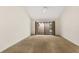 Bright bedroom with plush carpeting and sliding glass doors leading to a patio at 7505 4Th W Ave # 7505, Bradenton, FL 34209
