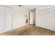 Bedroom with carpet, double closets and bathroom access at 7505 4Th W Ave # 7505, Bradenton, FL 34209