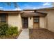 Front view of a condo with walkway, landscaping, and a brown door at 7505 4Th W Ave # 7505, Bradenton, FL 34209