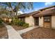Side view of condo showing building exterior, landscaping, and walkway at 7505 4Th W Ave # 7505, Bradenton, FL 34209