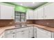 Kitchen sink and countertops with white cabinets at 7505 4Th W Ave # 7505, Bradenton, FL 34209
