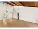Open living room with tile floor and view into kitchen area at 7505 4Th W Ave # 7505, Bradenton, FL 34209