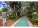 Shuffleboard court nestled in a lush, tree-lined community at 7505 4Th W Ave # 7505, Bradenton, FL 34209
