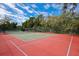 Two lighted tennis/pickleball courts with surrounding fence at 7505 4Th W Ave # 7505, Bradenton, FL 34209