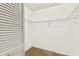 Good-sized walk-in closet with wire shelving and louvered door at 7505 4Th W Ave # 7505, Bradenton, FL 34209