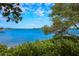 Serene waterfront view with lush vegetation and clear blue water at 7505 4Th W Ave # 7505, Bradenton, FL 34209