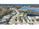 Community featuring a lake and many homes at 7521 Ridgelake Cir, Bradenton, FL 34203