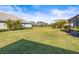Spacious backyard with pond view and lush lawn at 7521 Ridgelake Cir, Bradenton, FL 34203