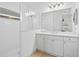 Bright bathroom with walk-in shower, white vanity, and tiled floor at 7521 Ridgelake Cir, Bradenton, FL 34203