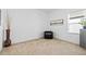 Small bedroom with a chair and large window at 7521 Ridgelake Cir, Bradenton, FL 34203