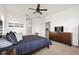 Primary bedroom with a ceiling fan and dresser at 7521 Ridgelake Cir, Bradenton, FL 34203