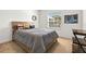 Cozy bedroom with a wooden bed frame and window at 7521 Ridgelake Cir, Bradenton, FL 34203