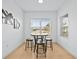 Small breakfast nook with a round table and four stools at 7521 Ridgelake Cir, Bradenton, FL 34203