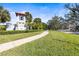 The Ridge community entrance sign with landscaping and a paved path at 7521 Ridgelake Cir, Bradenton, FL 34203