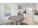 Kitchen with breakfast nook, island, and view into living area at 7521 Ridgelake Cir, Bradenton, FL 34203